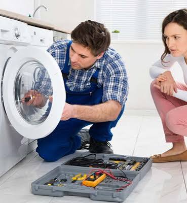 technician fixing a washing machine in alberton